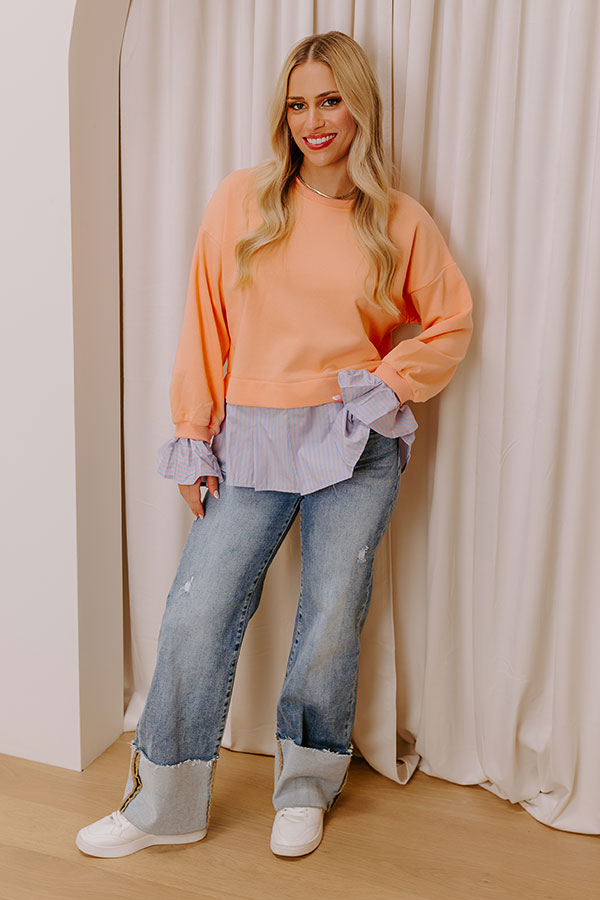 A classic ruffled top with New England-inspired charm and effortless style.